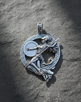 Polished finish silver Athena warrior pendant showing intricate spear and shield details on textured grey surface