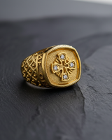 Gold finish variation of the cross signet ring showcasing stone settings and stippled background texture