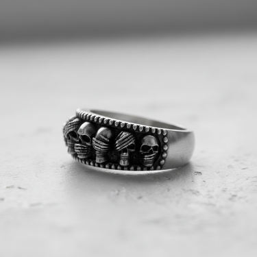 Side profile of handcrafted sterling silver skull ring band showing detailed carving and beaded borders