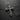 Two-tone silver crucifix pendant with a gold-plated corpus and four CZ stones, shown on a dark slate background.