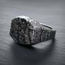 Side view of 925 sterling silver grunge ring showing thick band and organic rock details