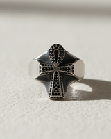 Front view of sterling silver ankh ring with black stones and oxidized finish