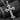 Gold vermeil variant of the cross pendant design displayed on dark charcoal wood