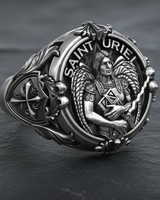 Angled view of silver archangel ring showing detailed angel wings and side shank shield with cross emblem