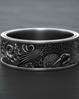 925 sterling silver Japanese crane ring featuring traditional bird and sun relief on textured dark background