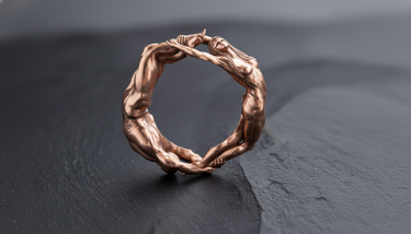 Detailed view of anatomical muscle sculpture on handcrafted silver eternal lovers ring