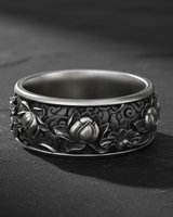 925 sterling silver lotus flower ring with intricate relief carving displayed on dark stone background