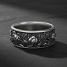 925 sterling silver lotus flower ring with intricate relief carving displayed on dark stone background
