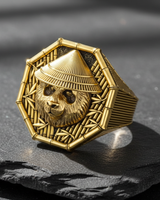 Angled display of gold vermeil panda ring featuring conical hat and hexagonal shape on slate background