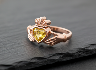 Elegant rose gold Claddagh promise ring with a brilliant yellow heart gem, symbolizing love, loyalty, and friendship.