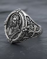 Side angle of silver religious ring showing IHSV cross engraving and detailed beard relief portrait