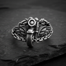 Front view of 925 sterling silver motorcycle ring with detailed tire and handlebars on stone surface