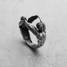 925 sterling silver angel sculpture ring featuring two winged figures reaching together on grey background