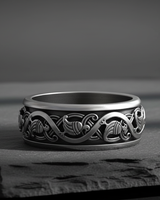 925 sterling silver Scandinavian wedding band featuring stylized waterbird and vine relief details on grey surface