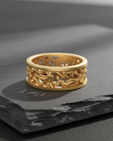 Perspective view of gold plated tree branch ring showcasing openwork band details and organic texture