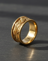 Angled view of gold plated equestrian ring capturing the light and intricate stallion carving on the band