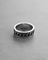 High angle view of handcrafted silver chain ring showing intricate link details and band thickness