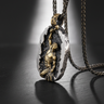 Handcrafted Silver Self Made Man Pendant featuring golden figure chiseling out of oxidized rock