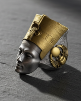 Side angle of Egyptian queen ring highlighting sacred winged scarab beetle detail on the textured silver band and gold crown