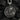 High-contrast sterling silver Jesus face pendant with oxidized finish displayed on dark textured rock background