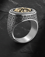 Side angle of handcrafted sterling silver signet ring showing intricate lattice shank design and texture