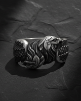 Side profile of silver double headed eagle ring showing intricate relief carving and oxidized finish for depth and contrast