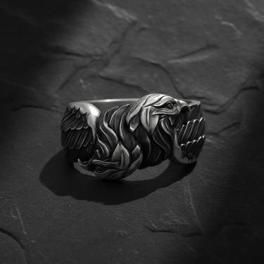 Side profile of silver double headed eagle ring showing intricate relief carving and oxidized finish for depth and contrast