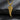 Gold vermeil silver angel wing pendant with intricate feather texture displayed on dark stone background