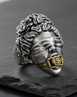 Front view of the handcrafted Silver Justice Ring, focusing on the blindfolded Themis face and oxidized finish details.