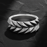 925 sterling silver geometric armor ring with raised triangular scale pattern on dark stone background