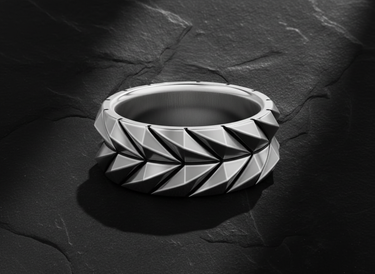 925 sterling silver geometric armor ring with raised triangular scale pattern on dark stone background