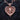 Gold plated sterling silver puppy pendant with heart and wings design displayed on textured charcoal wood
