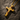 Gold vermeil silver cracked cross pendant with red gemstones displayed on dark textured stone background