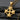 14k gold vermeil Maltese cross pendant with polished finish on dark stone background