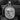 Silver Jesus pendant with orthodox iconography displayed on dark textured surface highlighting craftsmanship