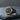 Men's Silver Flower of Life Ring in 925 sterling silver with a gold-tone floral centerpiece on a dark slate surface.