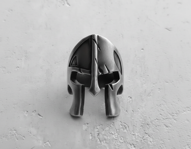 Front view of silver gladiator helmet ring showing nose guard and eye slit details