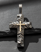 Front facing 925 sterling silver cross pendant featuring rugged oxidized texture and 14k gold center accent