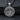 Front view of 925 sterling silver Saint Benedict pendant featuring the saint holding a cross and book on dark stone background