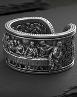 Side view of adjustable religious ring showing Latin inscription and open cuff design