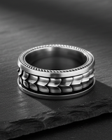 Side view of handcrafted 925 sterling silver dragon ring showing scale texture and thickness