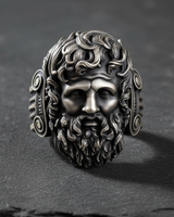Front view of 925 sterling silver Zeus Jupiter ring featuring a detailed bearded face and oxidized finish on textured slate background