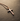 Angled view of rustic cross necklace in rose gold finish showing intricate metalwork