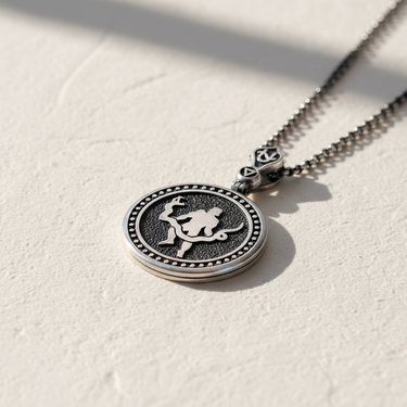 925 sterling silver Ophiuchus pendant featuring relief carving of the serpent bearer figure on textured background