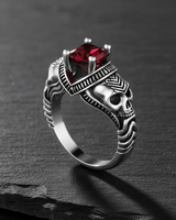Side profile of gothic skull ring showing intricate 925 sterling silver carving and ribbed band