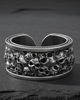 925 sterling silver skull ring with oxidized finish showing detailed ossuary design on slate stone