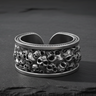925 sterling silver skull ring with oxidized finish showing detailed ossuary design on slate stone
