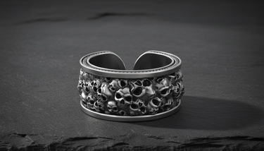 925 sterling silver skull ring with oxidized finish showing detailed ossuary design on slate stone
