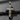 Front facing 925 sterling silver cross pendant featuring rugged oxidized texture and 14k gold center accent