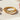Close-up view of the 14K gold vermeil infinity stone ring highlighting the intricate looping band and sparkling stones